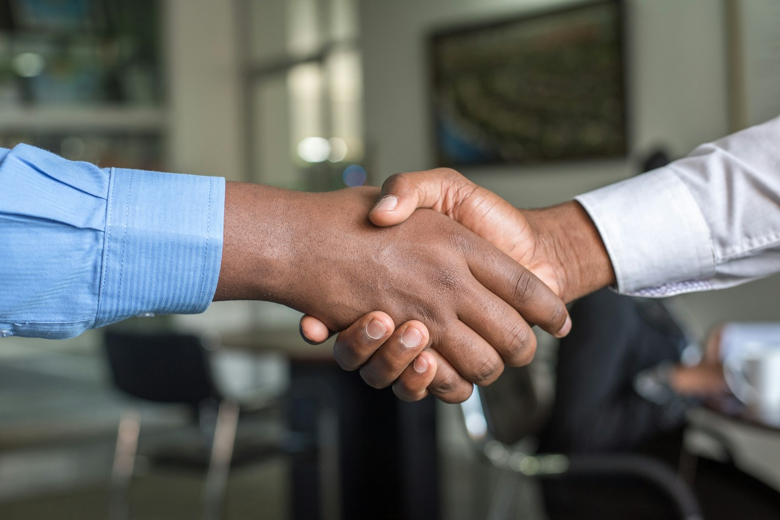Summit Electrical electrician shaking hands with a customer